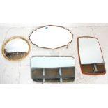 A group of four vintage retro wall mirrors to include a gilt framed porthole mirror, an oak framed