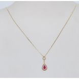A hallmarked 9ct yellow gold ladies pendant necklace having a central synthetic ruby droplet with