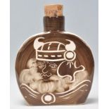 A Rushton Pottery ceramic flask having a brown and white glaze with a with a Viking man to the