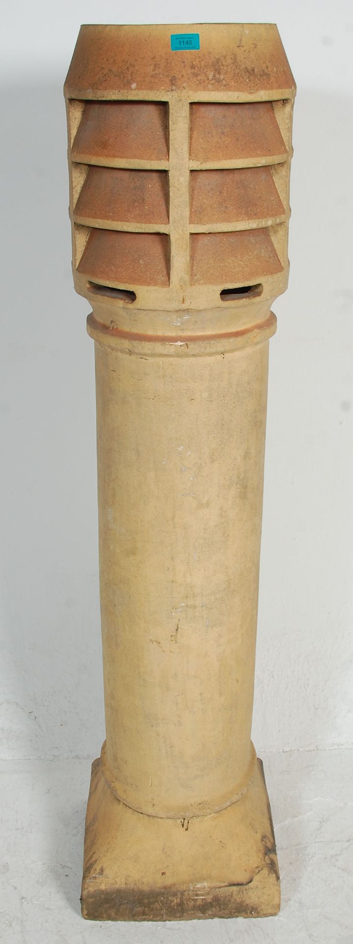 A large 19th Century Victorian chimney pot of cylindrical form. 150cm x 40cm x 40cm.