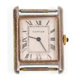 A vintage silver cased Cartier style tank watch wrist watch having a rectangular face with a white