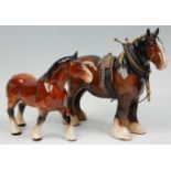 A  collection of 2 Beswick horse porcelain figurines to include a bay coloured shire horse with