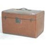 A vintage early 20th Century travelling trunk bound in brown canvas with painted initials WT and a