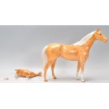 A large Beswick ceramic palomino horse figurine to