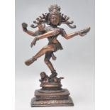 A good early 20th Century bronze figure of Shiva Nataraja God of Dance shown standing on a dwarf