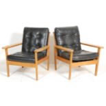 A pair of vintage retro mid 20th Century armchairs in the manner of Sibast having teak wood frames