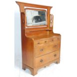 A 19th Century Victorian Arts and Crafts oak mirror backed dressing chest of drawers having a flared