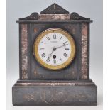 A 19th century Victorian slate and marble 24hr mantel clock having a white enamel face with a
