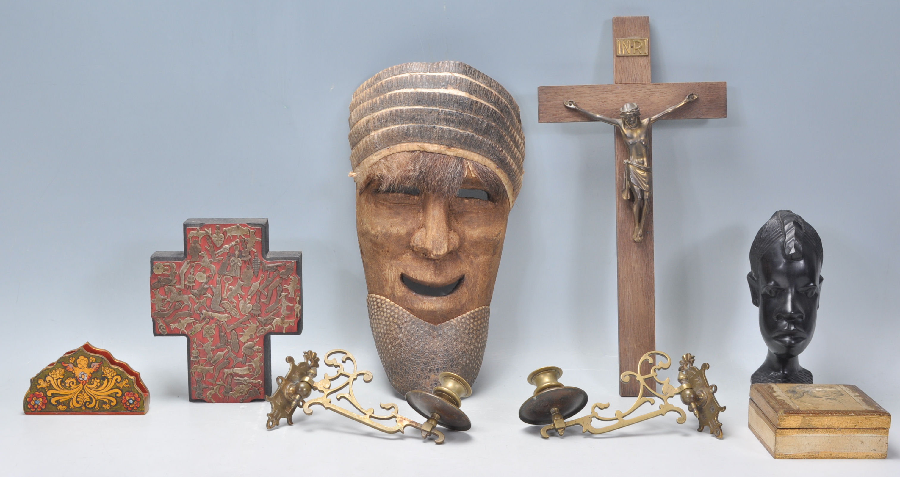 A collection of various items to include a tribal mask, decoupage white metal adorned handmade