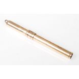 A hallmarked 9ct gold vintage mechanical propelling toothpick having a bale to the top and sliding