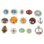 A collection of fifteen vintage 20th Century brooches to include a scottish sword brooch set with