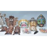 A large collection of Chinese and Japanese oriental theatre / wall masks. Many of hand painted