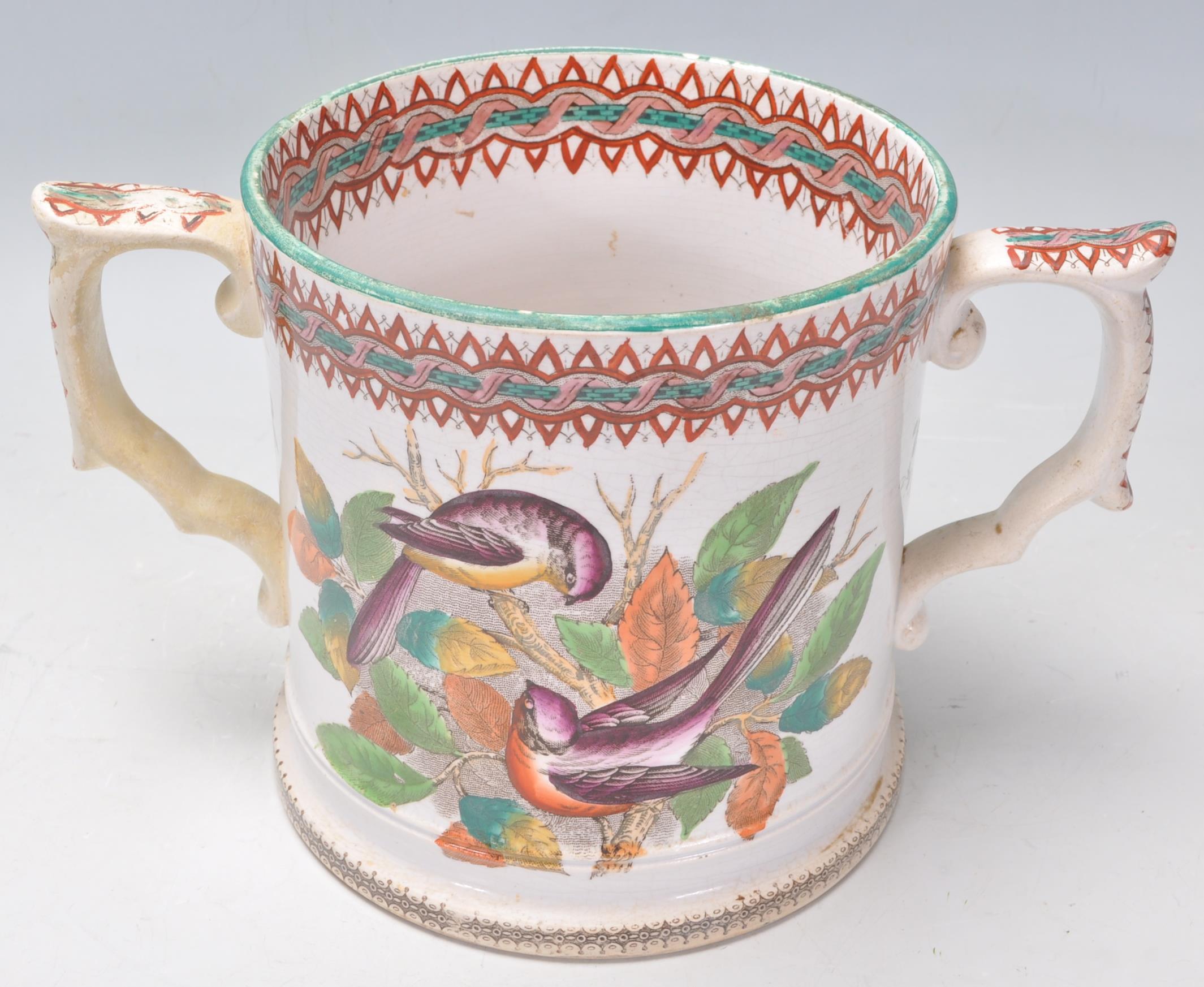A 19th century Victorian Staffordshire twin handled marriage loving cup - mug being cream glazed - Image 5 of 7