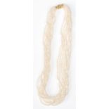 A good quality ladies eight strand pearl necklace having a 9ct gold clasp of twist design.