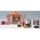 A collection of Mexican folk art hand carved religious figures to include 2 vibrant nativity
