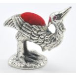 A stamped 925 silver pincushion in the form of a of an emu having a red velvet cushion to the back