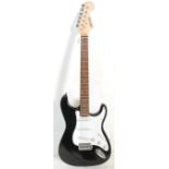 A good Fender style six string electric guitar by Groove having a white scratch guard and black body