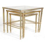 A 20th Century French design brass  nest of three square tables having brass framed with reeded