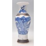 A 19th Century Chinese crackle glaze baluster vase having hand painted blue and white decoration