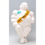 A vintage Michelin Tyres light-up advertising mascot. Plastic construction, with a yellow and
