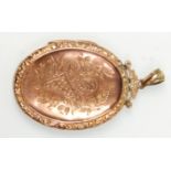 A good 9ct gold back and front engraved locket pendant having decoration of a floral basket with