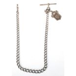 An early 20th century silver 925 albert chain complete with t-bar and lobster clasp being adorned
