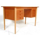 A vintage retro Danish 1960's / 1970's teak wood writing desk having a central kneehole flanked by