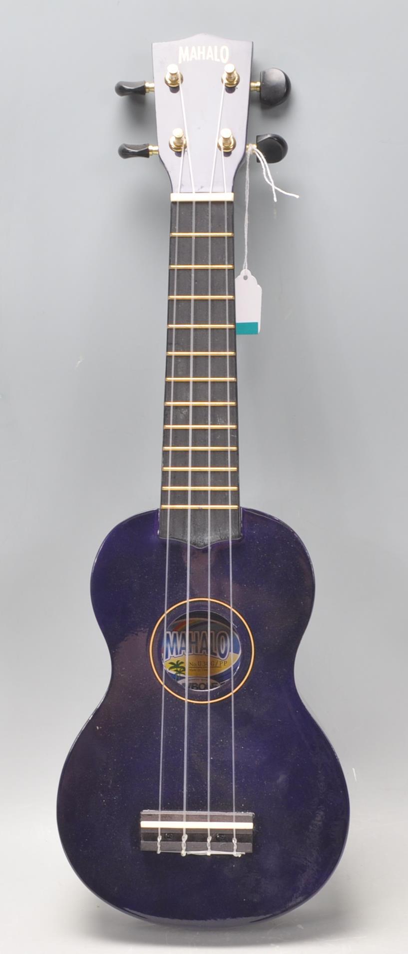 A good Mahalo made four string ukulele finished in blue. 52cm long.