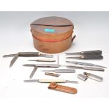 A collection of vintage pen knives to include a carved wooden handled examples, an ivorine pen
