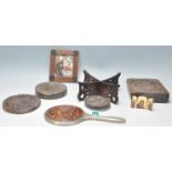 A mixed group of to include four antique round carved oak panels, a Chinese folding stand, small tri
