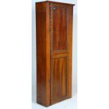 An early 20th Century oak housekeeper cupboard / kitchen cupboard having top and bottom doors with