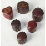 A good group of six antique vintage leather ring jewellery boxes, mostly burgundy with some having