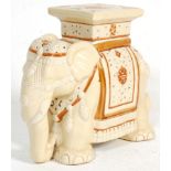A vintage 20th Century ceramic side table / stool / plant stand in the form of an elephant having