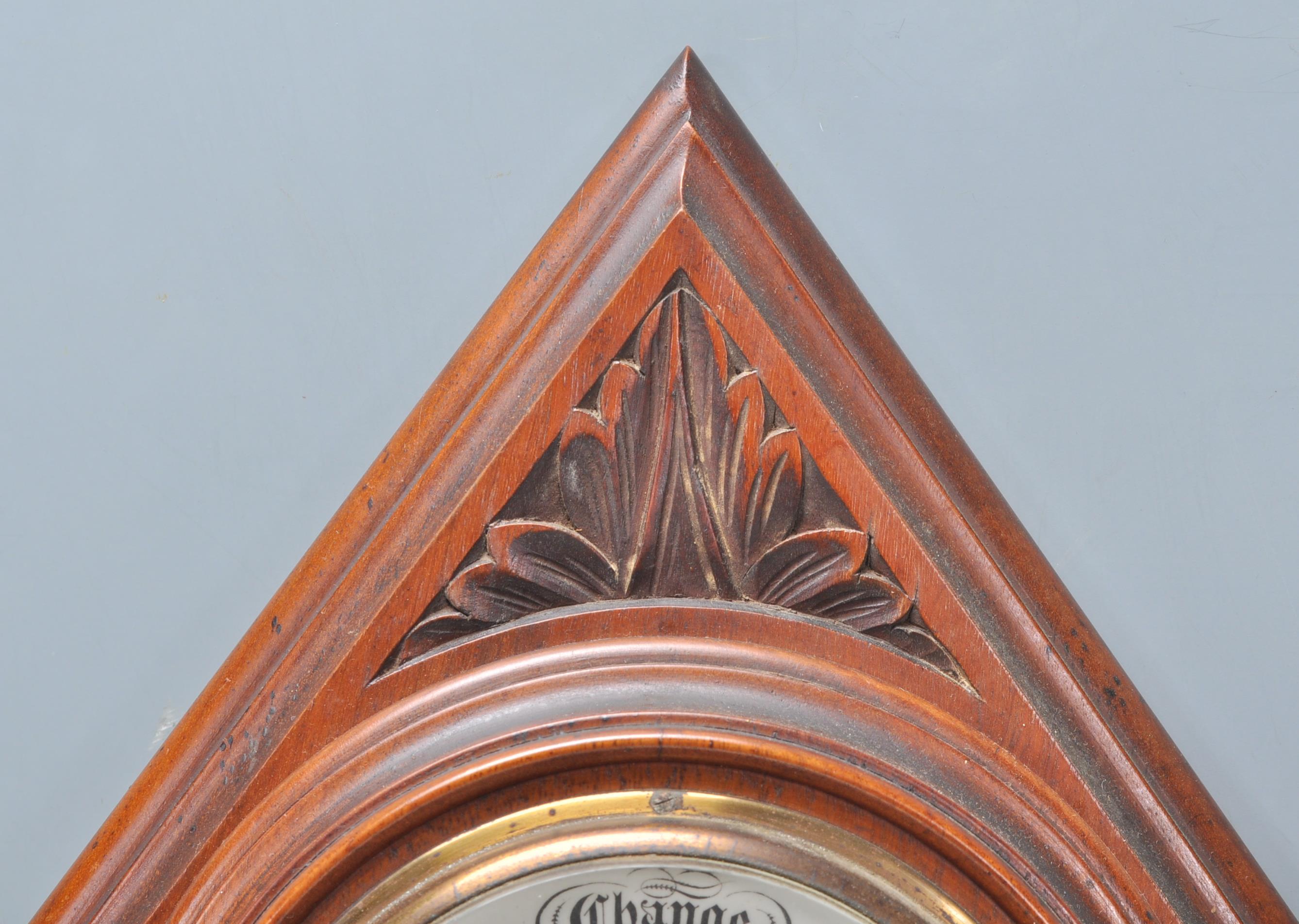 An early 20th Century carved oak barometer of lozenge shaped form having an enameled central round - Image 2 of 5