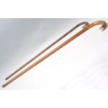 Two antique 19th Century walking stick canes to include a faux bamboo walking stick having a