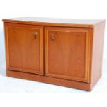 A 20th century  teak door two cupboard of good small proportions having a shelved interior. Raised