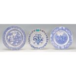 A group of three antique blue and white plates to include a 18th Century Delft plate being hand