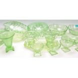 A group of early 20th Century Art Deco 1930's green uranium glass ware to include decorative vases
