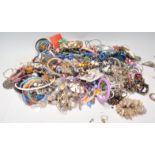 A large collection of vintage costume jewellery to include a good selection of beaded necklaces,