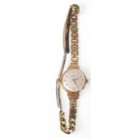 A vintage ladies 9ct gold wrist watch by Victor having champagne dial with Arabic numeral chapter