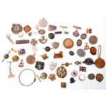 A collection of mixed vintage badges and medallions to include military badges; Australian