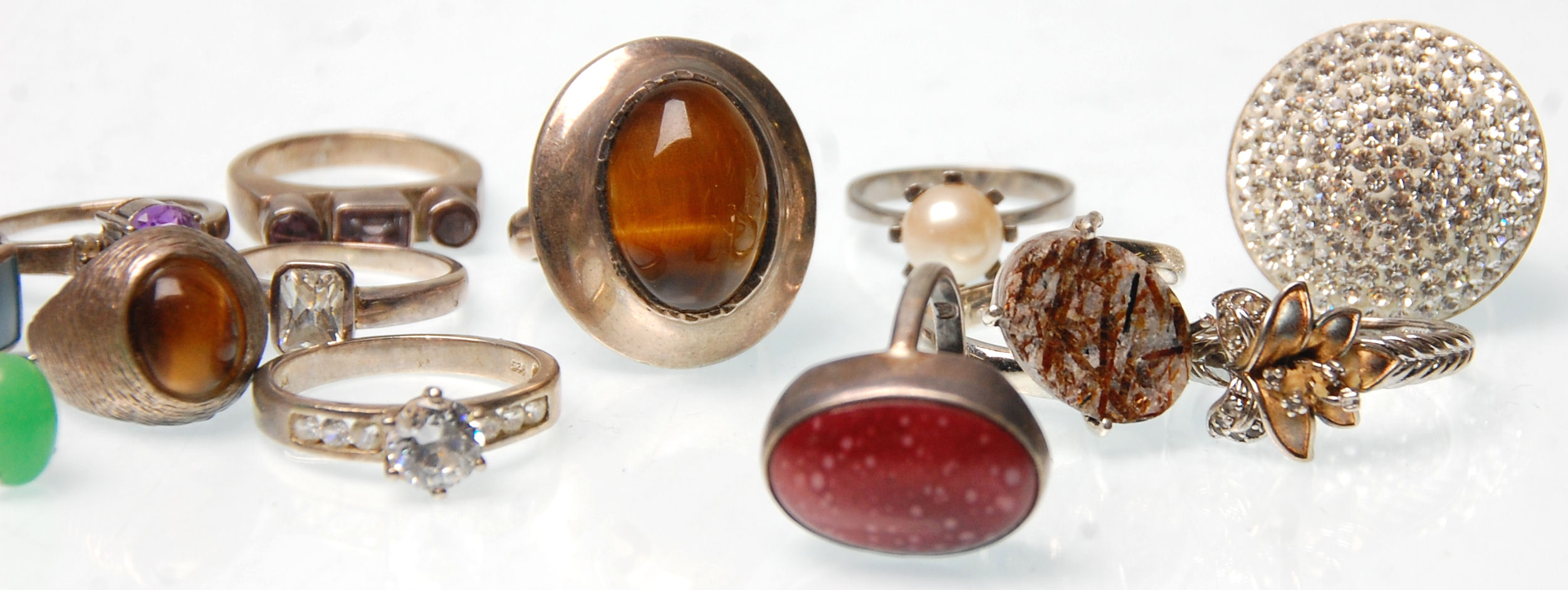 A collection of fifteen vintage silver rings to include two rings set with tigers eye, a redstone - Image 3 of 4