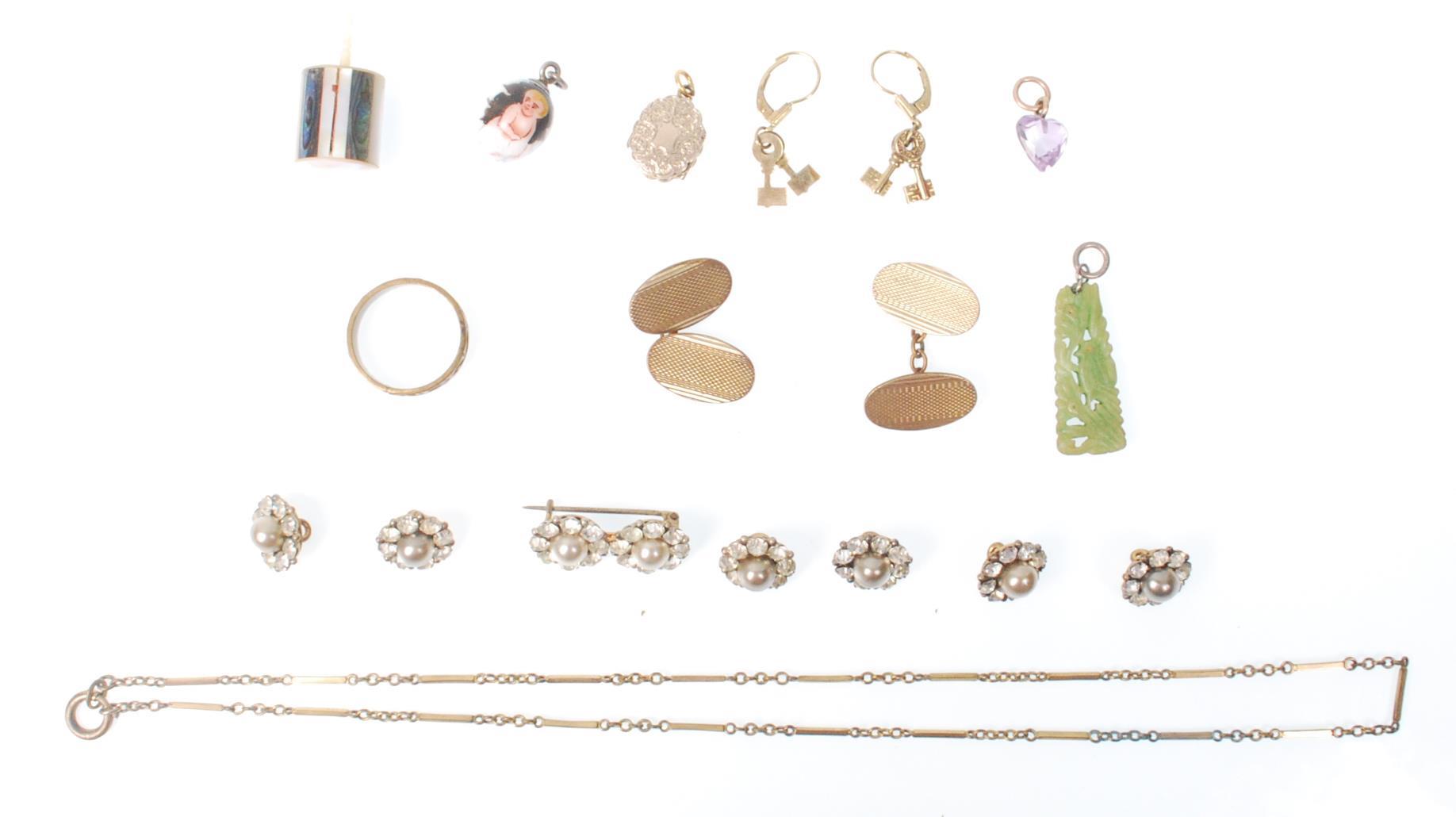 A collection of jewellery to include a gilt 19th Century double opening locket of oval form having