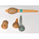 A collection of  four 20th Century South American finely carved fruit seed pods / gourds each