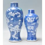 Two 19th Century Chinese blue and white hand painted baluster vases decorated with the prunus