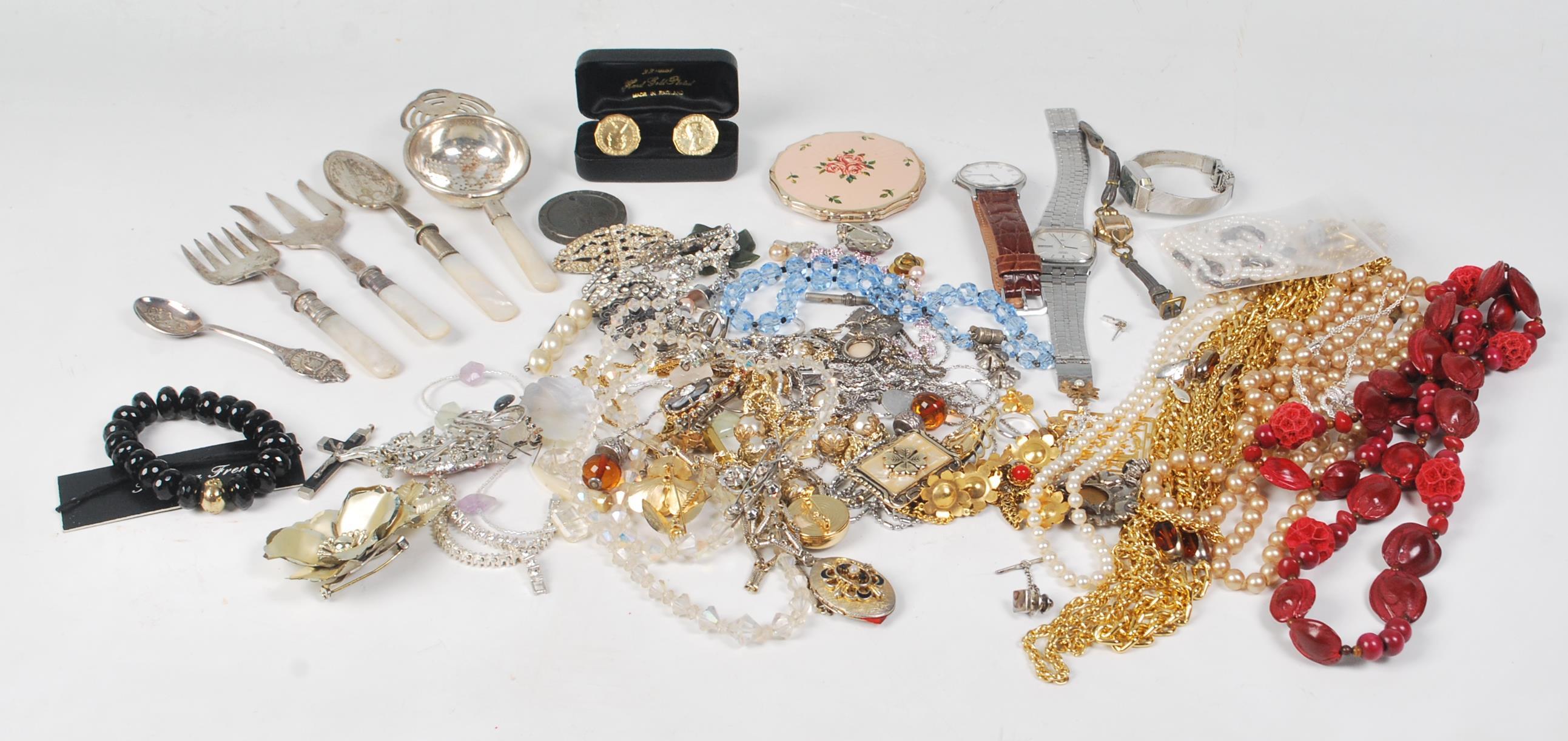 A large bag of costume jewellery to include 22ct gold hand plated coin cufflinks, Seiko Quartz