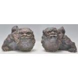 A matching pair of early 20th Century Chinese stone Fu Dogs / Dogs Of Fo garden ornaments.