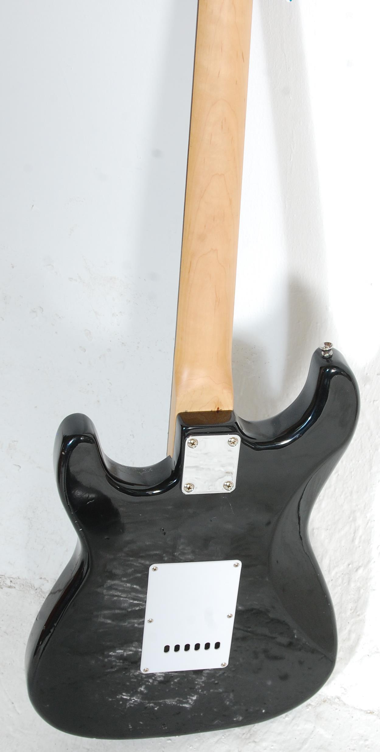 A good Fender style six string electric guitar by Groove having a white scratch guard and black body - Image 6 of 6