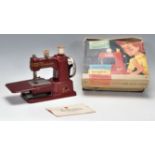 A vintage 20th Century Vulcan Senior childs sewing machine. Appears complete in the original box.