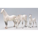 A  collection of 3 Beswick horse porcelain figurines to include 2 dapple grey coloured mares and a